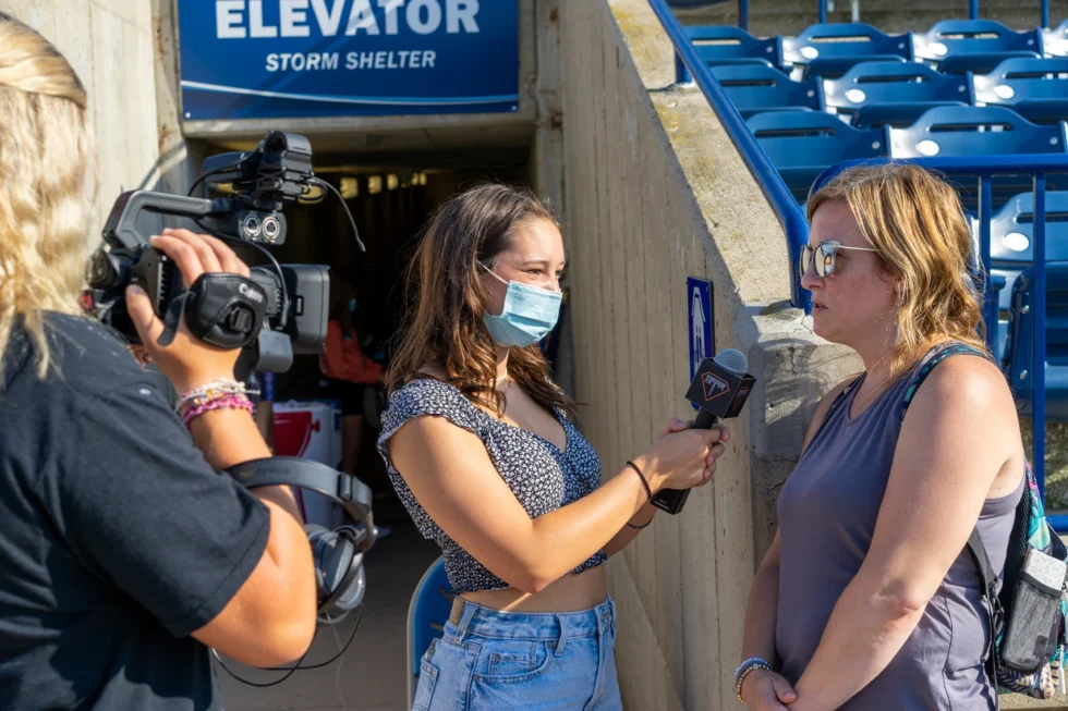 Student camera operator working inside the ballpark