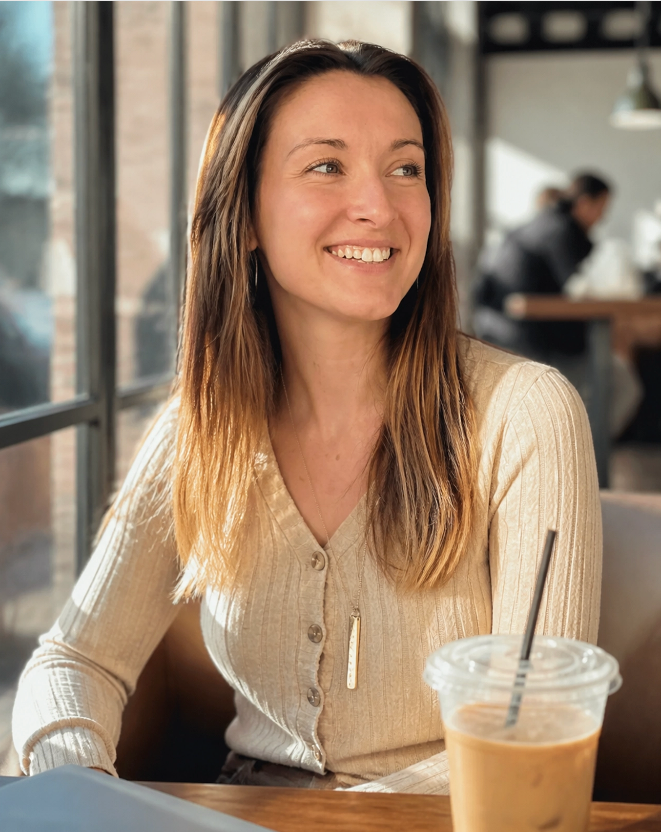 Brittany Meyers, founder of Chaos to Clarity Digital Consulting, smiling at a coffee shop