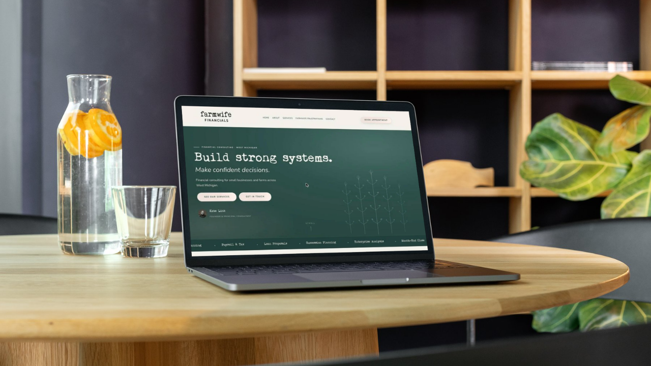 Farmwife Financials website shown on a laptop